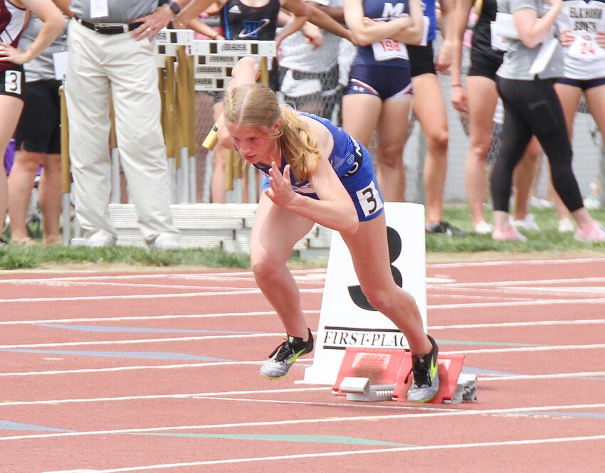 Coral Collins of Seward leaves the starting blocks in the Class B 4x100-meter relay May 18 at state.