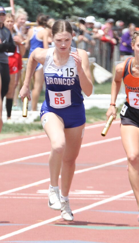 Cora Payne of Centennial leaves the starting line in the 4x800-meter relay May 19.