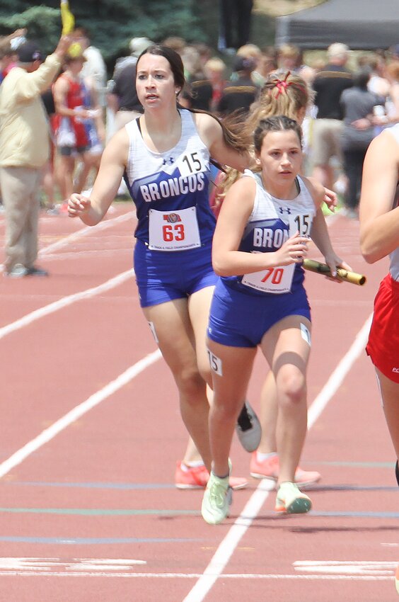 Karley Naber hands the baton to Ella Wambold for Centennial in the 4x800-meter relay May 19.