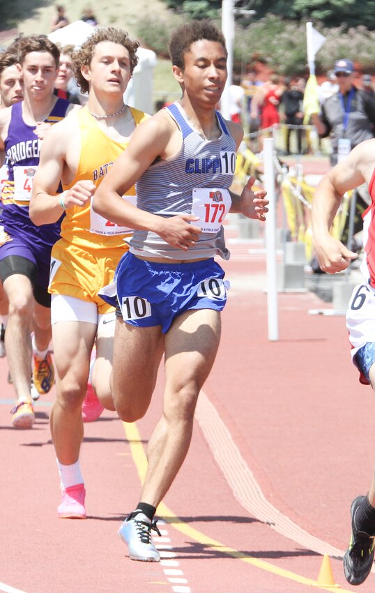 Nathan Swenson of Malcolm maintains his pace in the 800-meter run May 20.