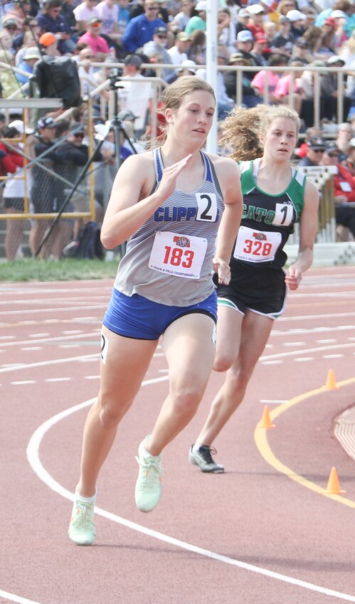 Halle Dolliver of Malcolm rounds the first curve in the 400-meter dash preliminary heat May 19. Although she did not make the finals, the MHS freshman anchored the 4x400-meter relay team to a fourth-place finish.
