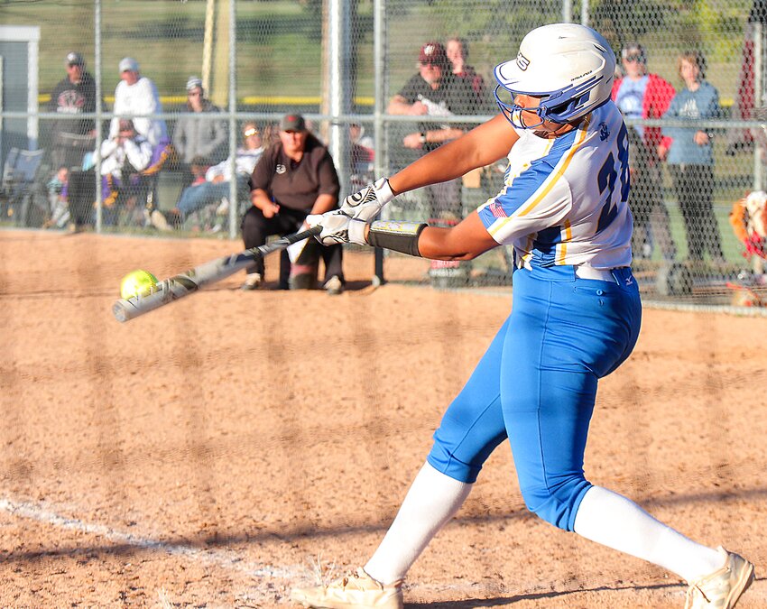 Seward's Lovely Hibbert follows through on a double against Waverly Oct. 7 during the district final.