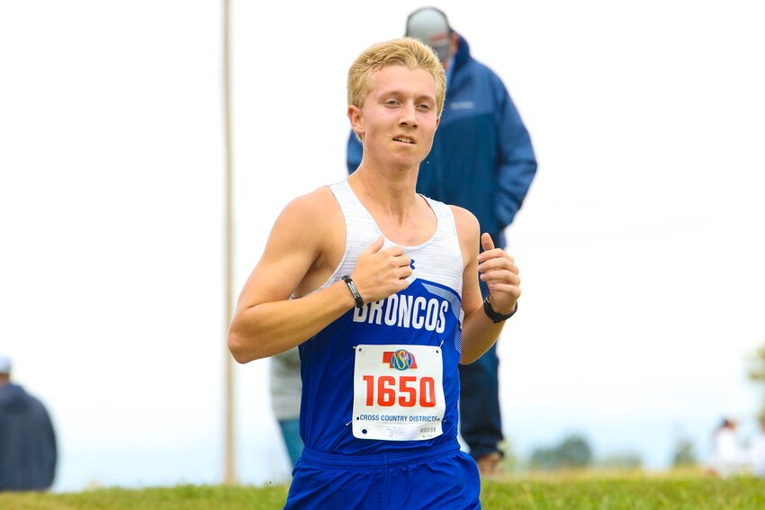 Matthew Hoops of Centennial pushes for the finish at the D1 district cross country meet in Weeping Water on Oct. 12.
