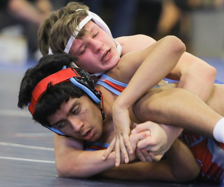 Malcolm 126-pounder Cooper Vetick works a cradle on Andres Castro of Ralston during their conference tounament matchup Jan. 26.