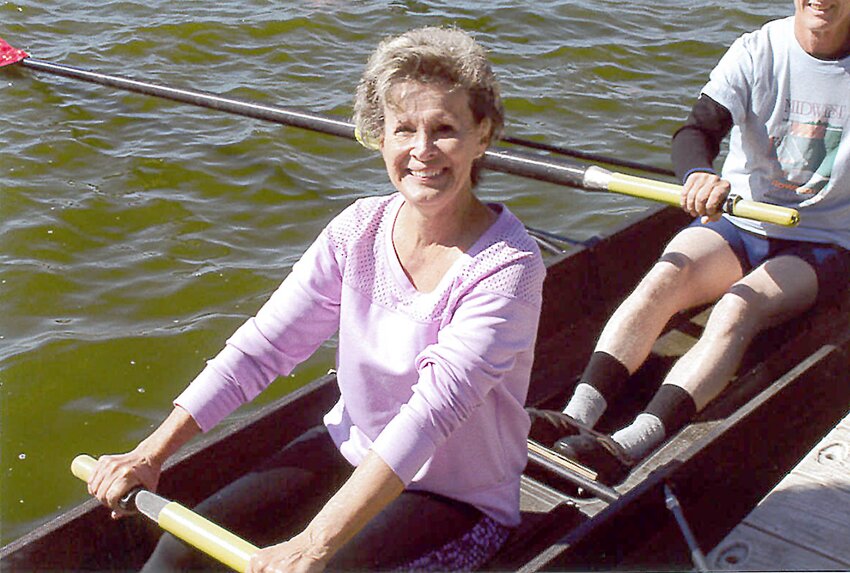 Ellen Jirovsky waits to start rowing at an alumni gathering recently.