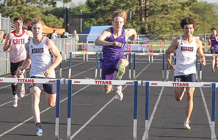 Isaac Roth leads the field to the final hurdle in the 300-meter hurdle finals at districts May 7.