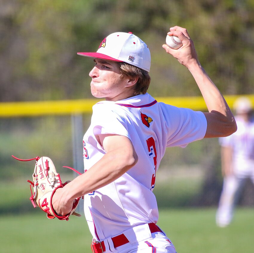 Nick Wendt of Crete/Milford winds up for a pitch against Hastings on April 29.