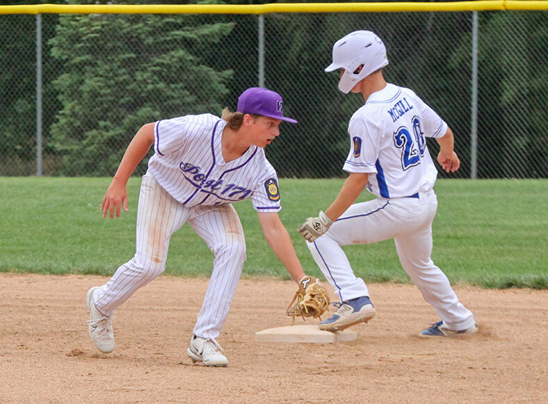 Miles McGill of Malcolm beats the tag attempt by Brett Bousquet of Milford at second base June 27.