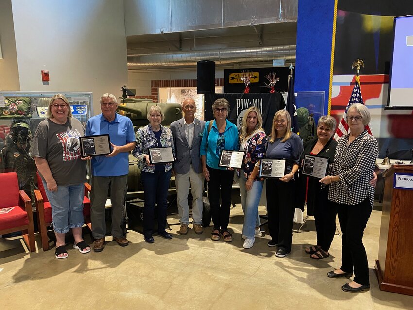 Families of Seward County prisoners of war and missing in action pose with Richard Burch, civilian aide to the Secretary of the Army (fourth from left), on POW/MIA Recognition Day at the Nebraska National Guard Museum in Seward. The families of Dale Carr, Bob Dowding, Wendell Rivers, Hal Cummins, Norman Weiler and Clifford Johnson were recognized.