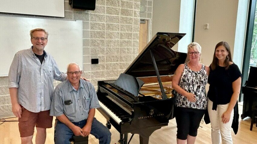 A Steinway Model B Spirio grand piano was donated by Andy and Dee Hartmann to Concordia University. Pictured with the piano are, from left, Concordia Music Department Chair Dr. Kurt von Kampen, Andy Hartmann, Dee Hartmann and CU Professor of Music Dr. Elizabeth Grimpo.