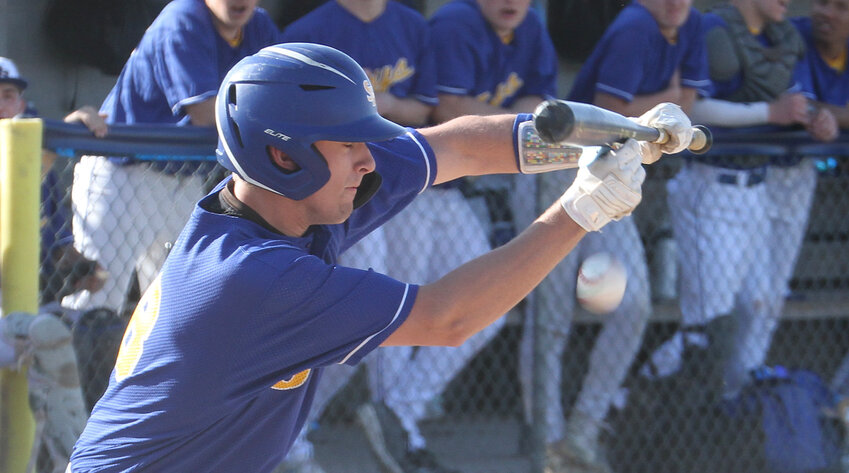 Connor Sveeggen of Seward lays down a bunt against Adams Central April 15. The Jays held off a late rally by the Patriots to get the 7-6 win.