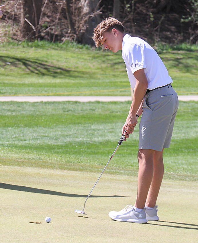 Zane Jackson of Milford taps in on No. 9 during the Milford Invite April 16.