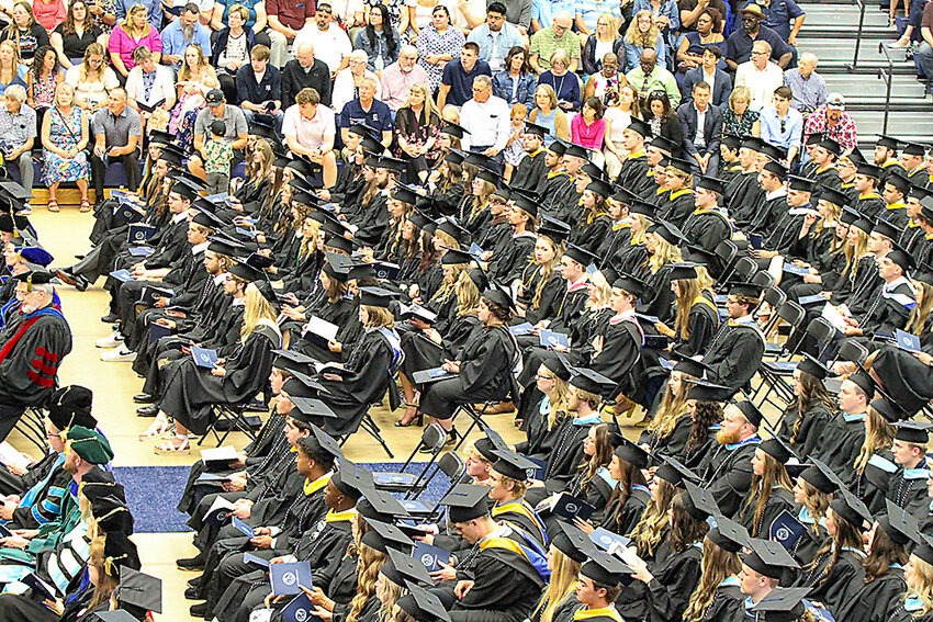 Candidates for graduation at Concordia University wait their turn to cross the stage and receive their diplomas May 10 at the university's commencement ceremony.