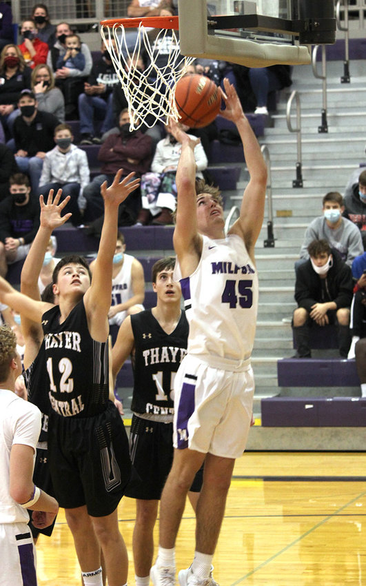 Cabe Schluckebier, a Milford High School junior, takes a shot in the Eagles' game Jan. 16 with Thayer Central..