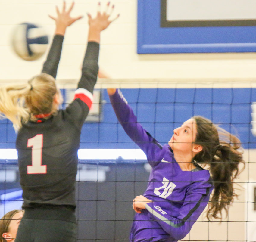 Celia Bontrager of Milford swings for a kill against David City Sept. 14 in a triangular at Malcolm.