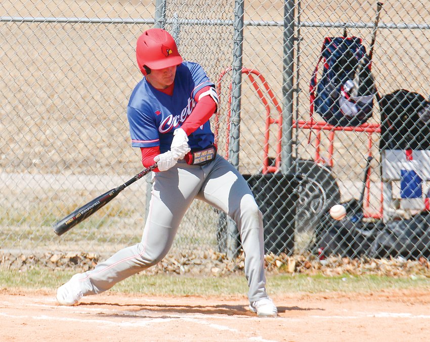 Madaux DeLong of Crete/Milford swings at a pitch April 2 during the Cardinals' game at Malcolm.