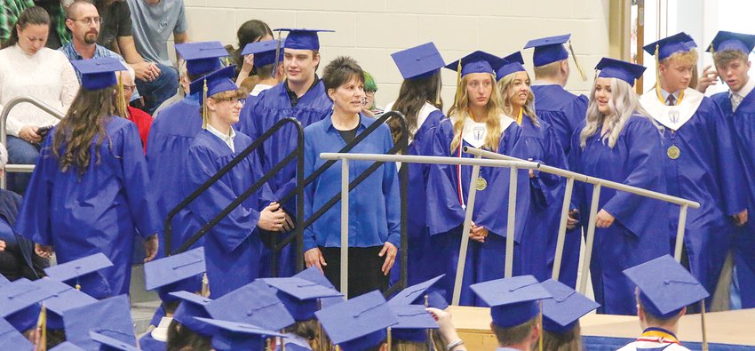 The Seward High Class of 2022 begins to line up before crossing the stage and receiving its diplomas May 15. See more graduation photos on page ____.