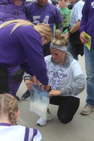 Sydney Thompson and Karlee Kuklis bag ice cream ingredients during an Eagle Olympics event Sept. 23 for Milford Homecoming Week. Groups of students had to shake up the ice cream while dancing to Vanilla Ice&rsquo;s &ldquo;Ice Ice Baby.&rdquo; Those who had the best moves and helped motivate their teammates won.
