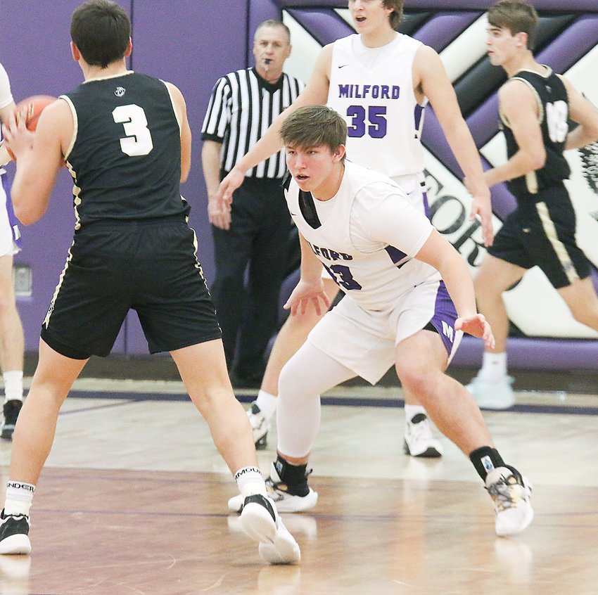 Milford's Alec Shook waits for Thayer Central's Will Heitmann to pass the ball during Jan. 14's game.