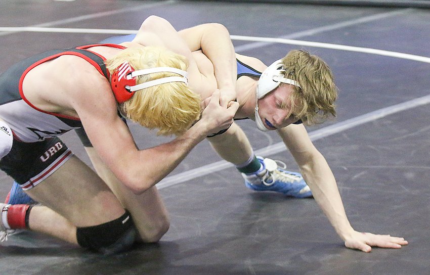 Jarrett Dodson of Centennial takes down Brendan Boyce of Ord in the first round of the Class C 145-pound tournament Feb. 16.