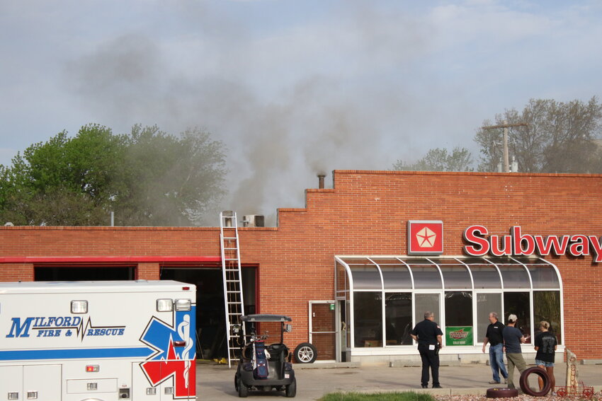 Milford Fire and Milford Police respond to a fire at Subway Motors the morning of May 10.