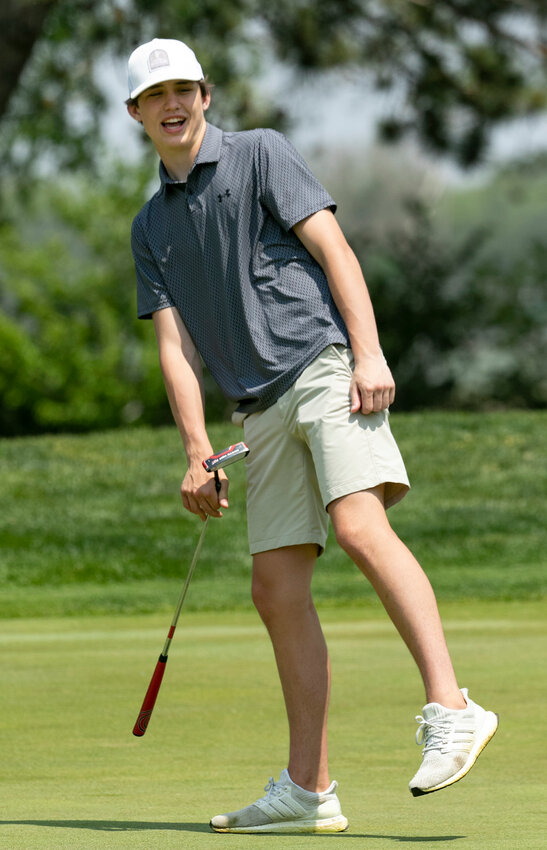 Centennial's Alex Hirschfeld reacts to a putt during second round action at the Class C state golf tournament in Columbus.