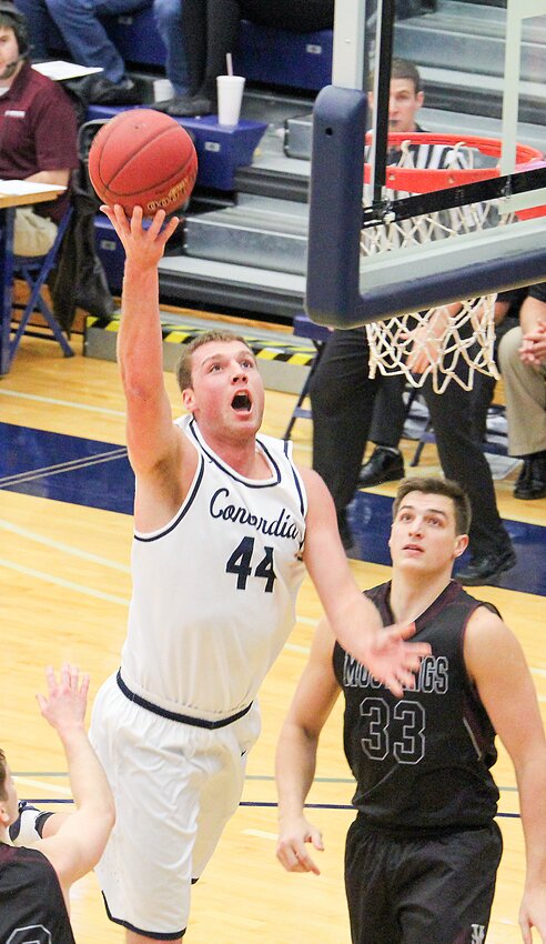 Chandler Folkerts reaches for the rim during Concordia University men's basketball action in 2017. Folkerts, a graduate of Milford High, was inducted into the CU Athletic Hall of Fame this fall.