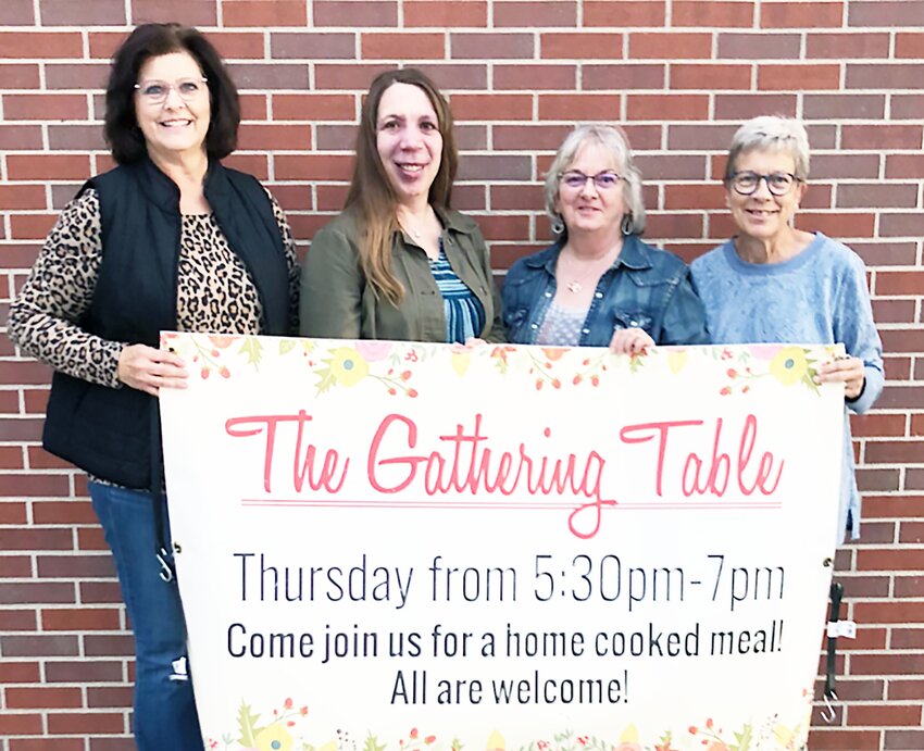 Gathering Table Committee members, from left, Roxie Stutzman, Mel Stutzman, Marietta Burkey and Sandy Troyer, advertise for their upcoming Thanksgiving meal. Committee members not pictured are Brent Stutzman and Megan Burkey.
