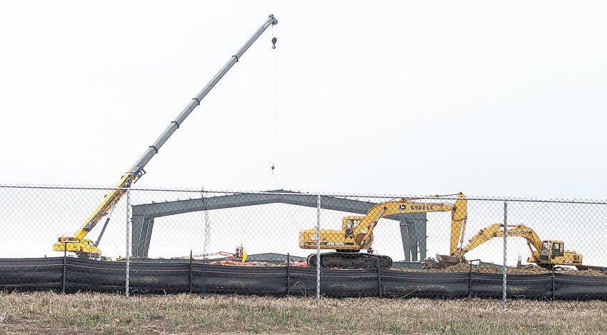 A crane lifts a portion of the Seward Wellness Center into place Feb. 22.