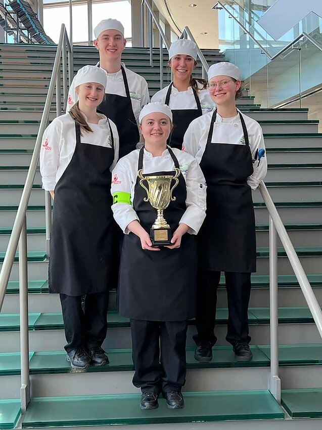 The Milford ProStart team members pose with its trophy. Pictured are, from left, (front row): Emma Hershberger; (second row) Maizie Kolb and Veronika Johns; and (back row) Gavin Piening and Ady Kroese