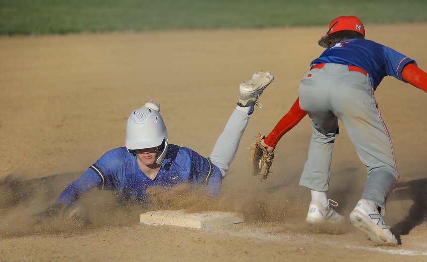 Malcolm's Carson Frank slides safely into third with a stolen base during the Clippers' 16-3 home victory over Crete/Milford March 18.