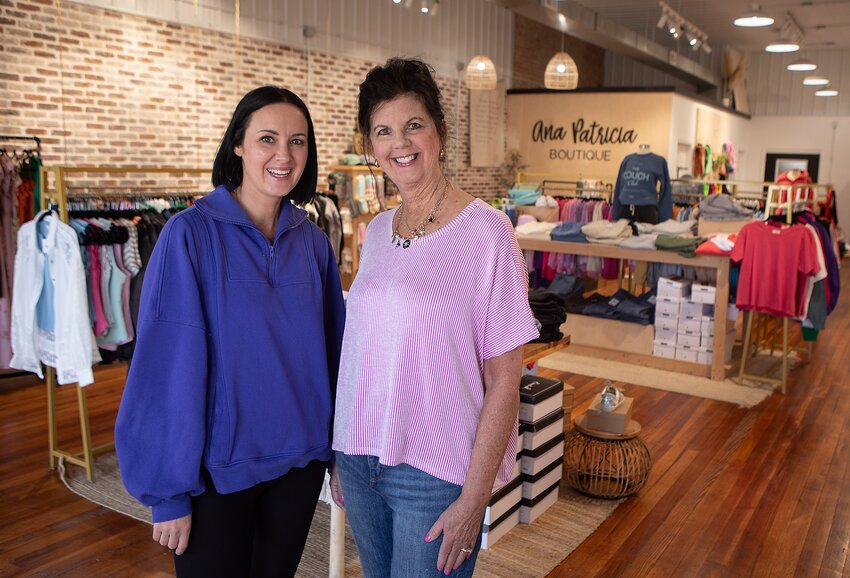 Nancy Velder, right, and her daughter, Erika Stauffer, pose for a photo in Ana Patricia Boutique, located in downtown Milford.