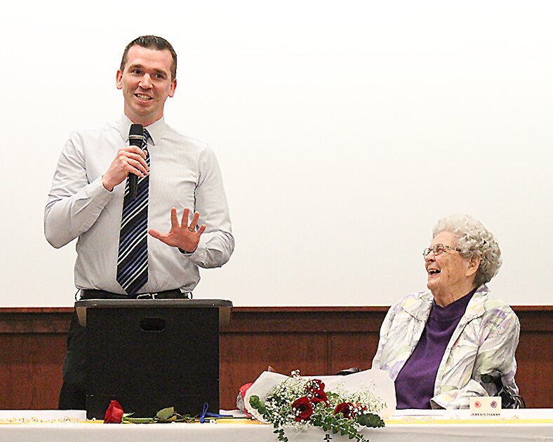 Clark Kolterman, center, shares a few words about his mother, Jean Kolterman (seated), as Mark Kolterman, left, and Ellen Chaffin, right, listen during a surprise celebration for Jean Kolterman's 75 years as a member of the General Federation of Women's Clubs Seward Women's Club April 10.