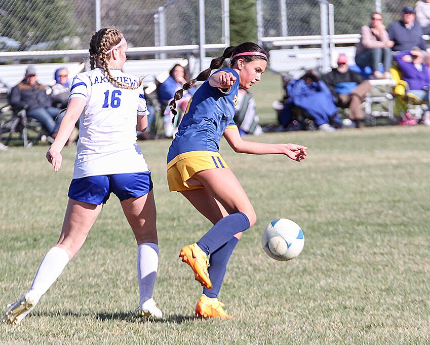 Vanessah Schluckebier steps in front of the Lakeview player for a steal during the conference tournament first round April 11.