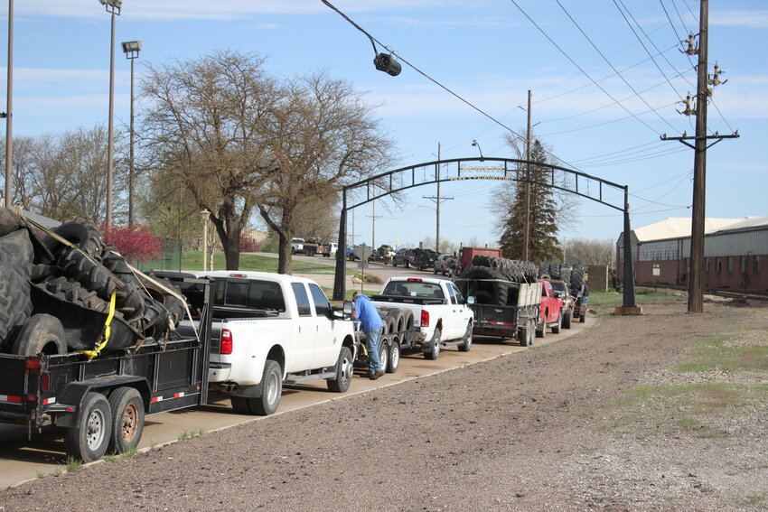 Haulers wait in line at 8:30 a.m. Friday morning, April 19, to drop off scrap tires at the Seward County Fairgrounds. By 11 a.m., some of these vehicles still hadn't made it to the arena to unload because of a higher-than-expected volume of participants.