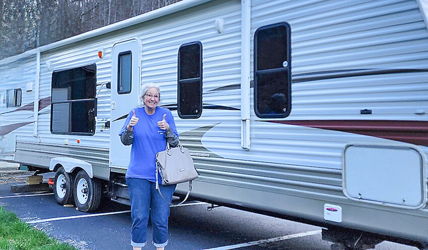Kitty Vacha gives a thumbs-up in front of her trailer. Vacha will live in the trailer while she serves as a missionary in Kentucky.