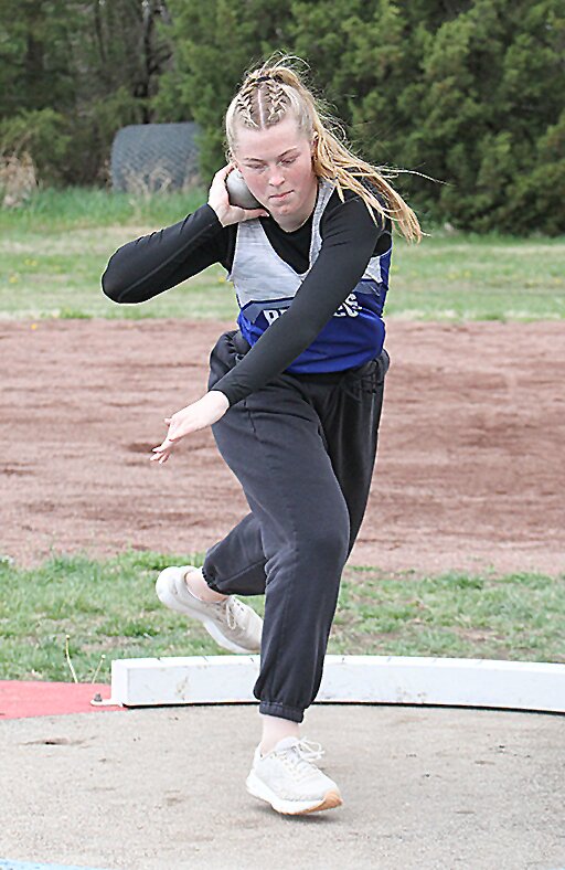 Catelynn Bargen of Centennial slides across the shot put ring in competition April 16. She won the event with a personal best throw of 34-11.