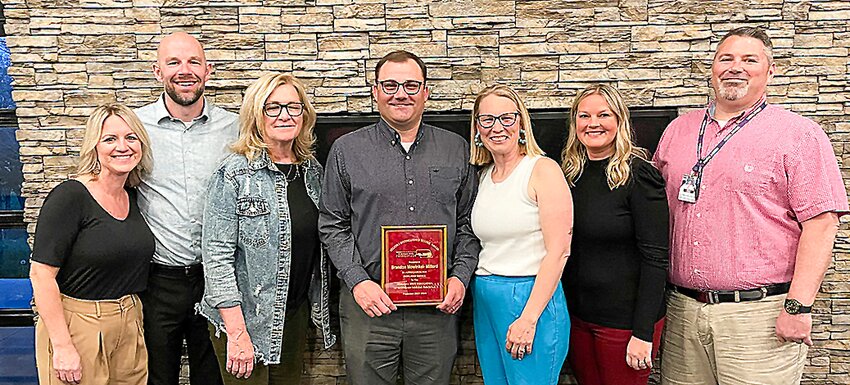 Milford Principal Dr. Brandon Mowinkel was presented the Distinguished Service Award at the recent Nebraska State Association of Secondary School Principals banquet. Administrative assistants were also recognized. Pictured are, from left, Rebekah Augustyn, Jason Weber, Kim Riley, Brandon Mowinkel, Shelly Mowinkel, Marissa Parman and Shawn Carlson.