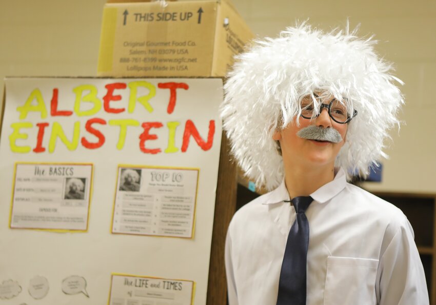 Albert Einstein, played by Milford Elementary fifth-grader Baylor Roth, discusses his life and times during the school's living history day May 14.