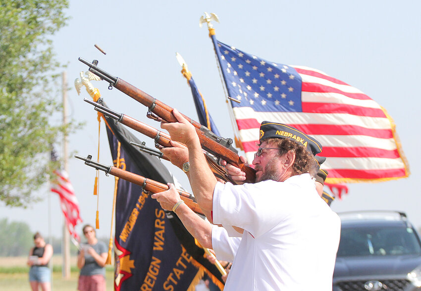 Larry Blecha, front, and other members of the Seward VFW and American Legion Honor Guard Roger Anderson, Alex Kufeldt and Jim Hild, fire their salute to the deceased at Seward's Memorial Day program in 2023.