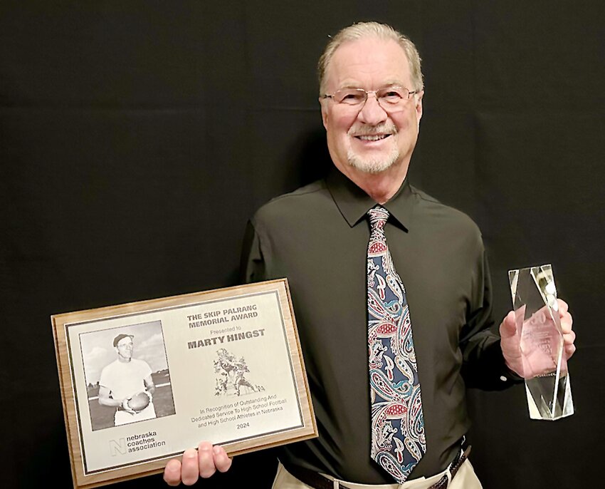 Former Milford head football coach Marty Hingst was named recipient of the Skip Palrang Award for coaching at the recent Nebraska Coaches Association banquet.