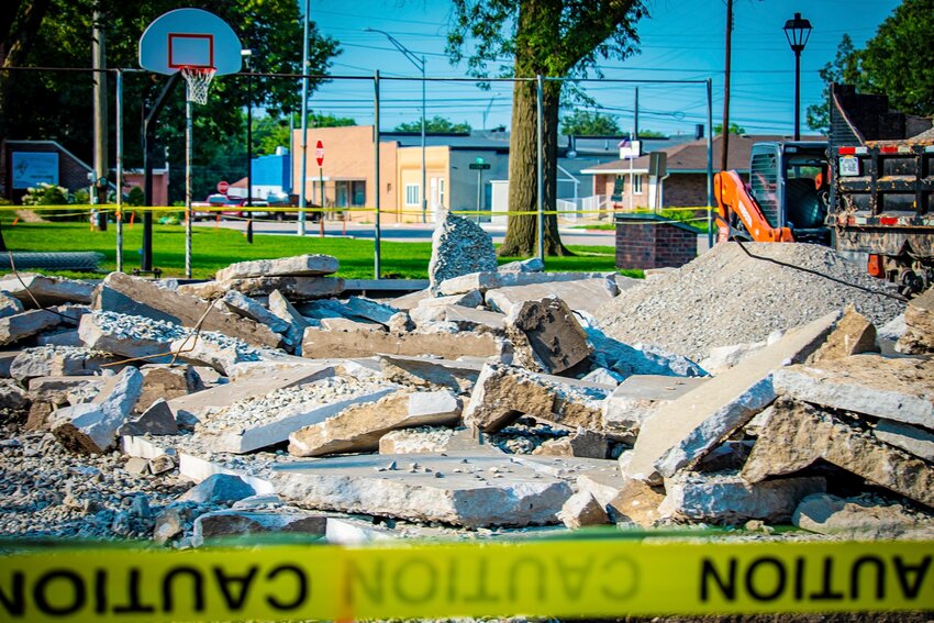 Concrete of the Milford basketball court is broken apart on July 11 in preparation for a new pad to be poured after correcting issues that lead to cracking.