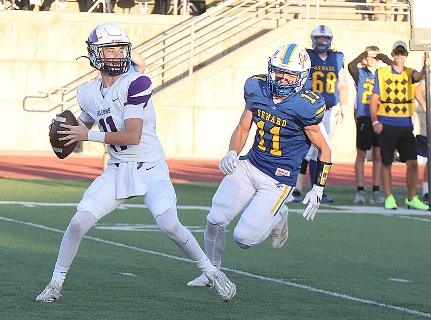 Kolton Loos of Seward tries to avoid a Lincoln Northwest tackle Sept. 27.