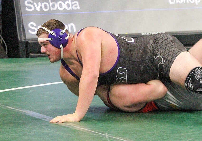 Garrett Schoen of Milford (top) pins Calib Svoboda of Bishop Neumann, the Class C defending state champion, in the consolation second round.