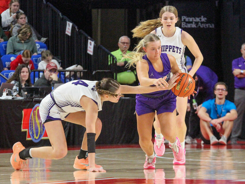Ayla Roth of Milford looks for an opening in the Minden defense March 7.
