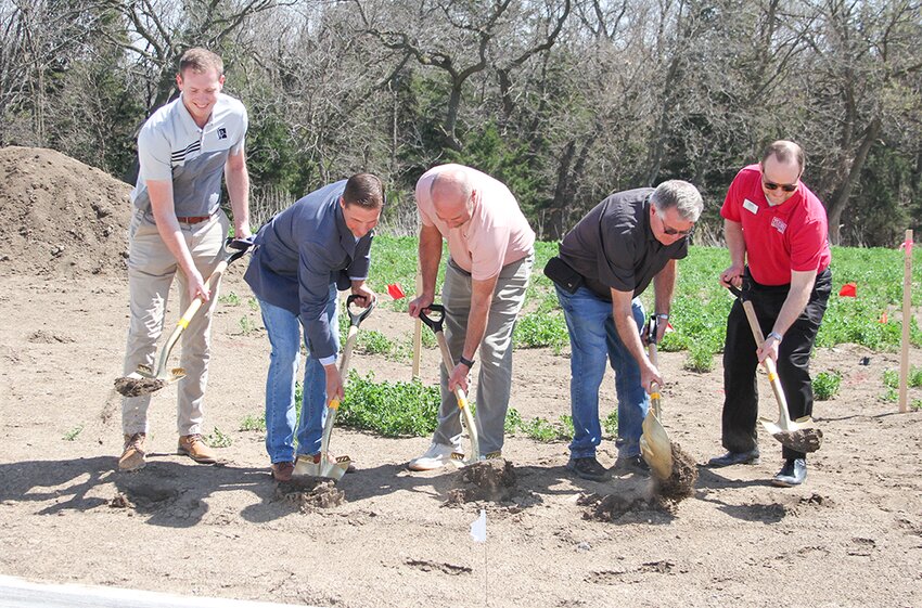 An official ground-breaking ceremony started work on Phase II of the Timber Creek Subdivision south of Southeast Community College in Milford April 16. Pictured are, from left, Isaac Kreikemeier of JEO, Milford Mayor Patrick Kelley, Joe Schluckebier of Timber Creek, Tim Troyer of Timber Creek and Jonathan Jank of the Seward County Chamber and Development Partnership.