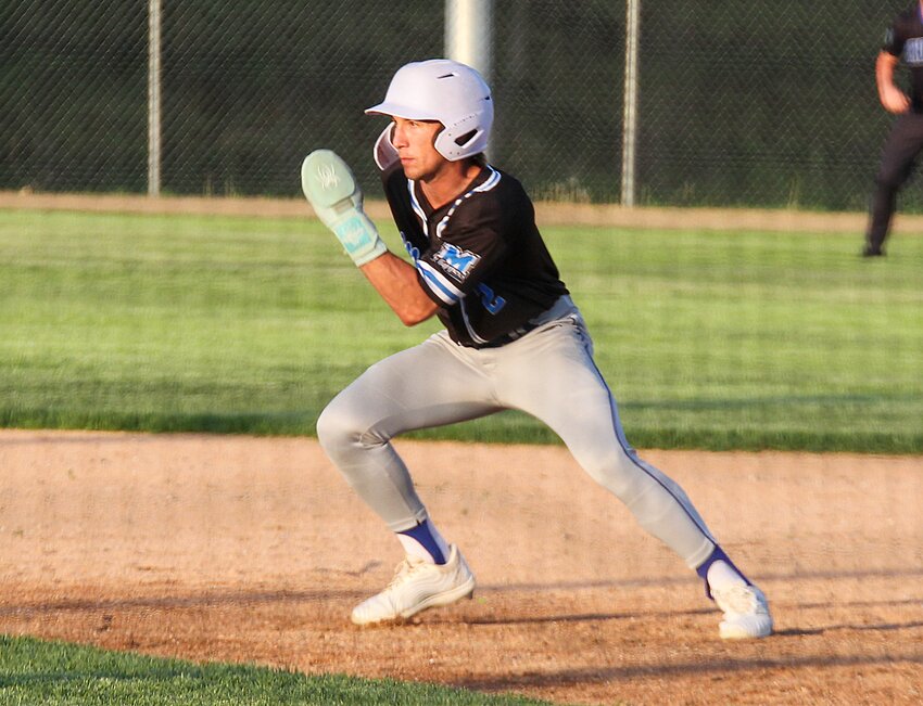 Christopher Burbach of Malcolm leads off second in the district semifinals against Centennial May 8.