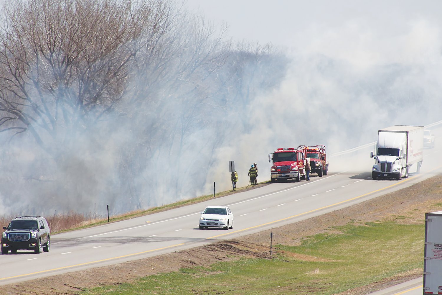 Seward and Milford Fire respond to a grass fire April 13 near 266th and Holdrege Road, just off the Seward I-80 interchange. The fire burned about 100 yards and up the embankment toward the interstate.