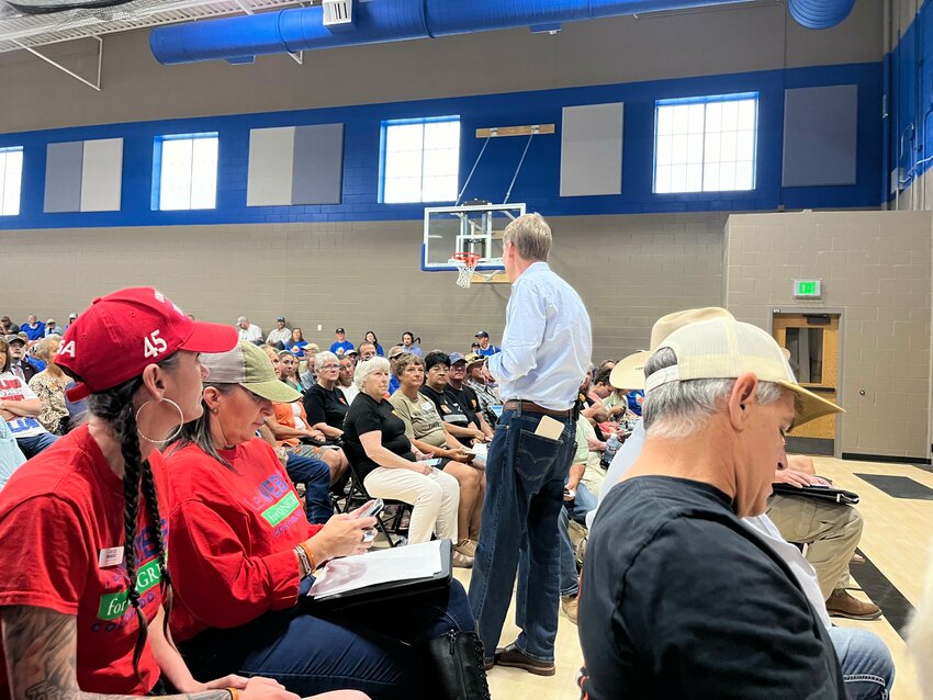 As many as 550 people attended the monument feedback session in Nucla. This image shows Senator Michael Bennet listening to the public comments.