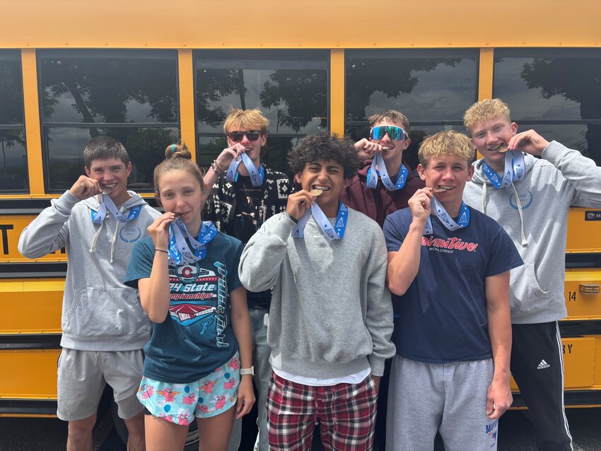 The Mustang track athletes earning medals are (from back to front, left to right) Cole Bray, Drake Long, Brycen Rummel, Austin Garvey, Cadence Shaw, Daniel Zunich and Owen Tackett.